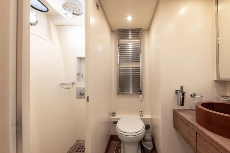  Yacht Photos Pics Luxurious bathroom interior of 2006 Mangusta 80 yacht, featuring modern fixtures and elegant design.