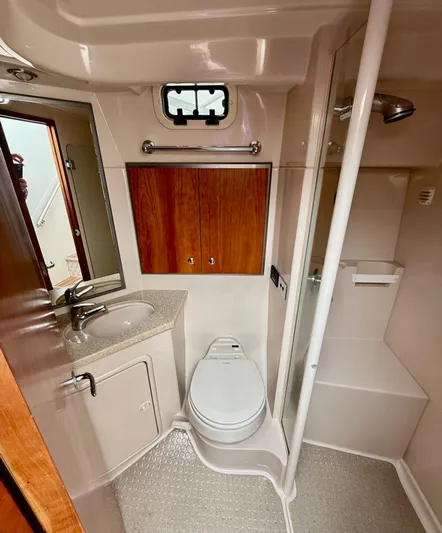  Yacht Photos Pics 2007 Riviera 3600 Sport Yacht bathroom with sink, toilet, and shower.