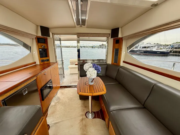  Yacht Photos Pics Interior of 2007 Riviera 3600 Sport Yacht with elegant seating and waterfront view.