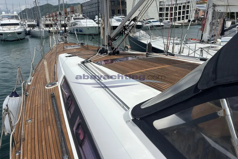  Yacht Photos Pics Beneteau Oceanis 58 yacht, 2010 model, docked in a marina with wooden deck.