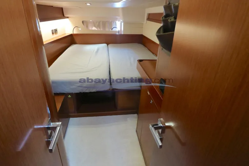  Yacht Photos Pics Cozy cabin interior of 2010 Beneteau Oceanis 58 yacht with double bed.