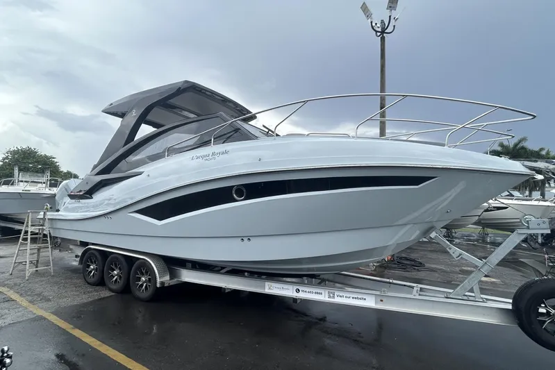  Yacht Photos Pics Luxury L'ACQUA LR350 boat on trailer, 2025 model, sleek design, parked outdoors.
