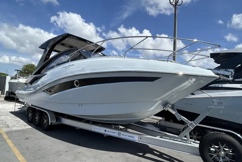  Yacht Photos Pics Luxury L'ACQUA LR350 boat on trailer, 2025 model, under clear blue sky.