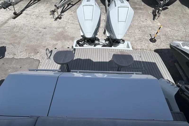  Yacht Photos Pics Rear view of 2025 L'ACQUA LR350 boat with dual outboard motors and deck seating.