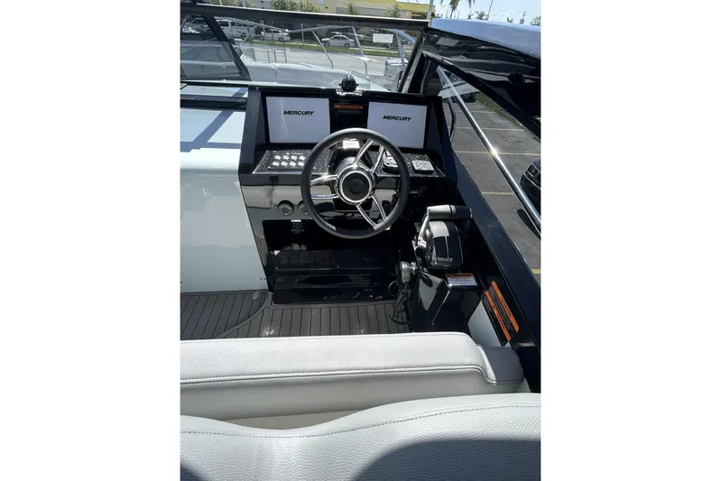  Yacht Photos Pics Helm of 2025 L'ACQUA LR350 boat with Mercury controls and modern dashboard.