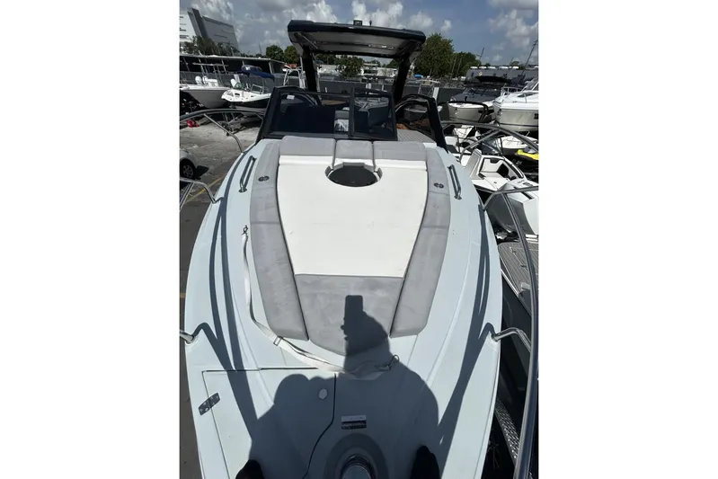  Yacht Photos Pics 2025 L'ACQUA LR350 boat with sleek design, docked under clear skies.