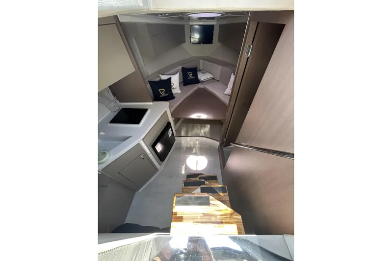  Yacht Photos Pics Interior of 2025 L'ACQUA LR350 yacht, featuring modern kitchen and cozy seating area.