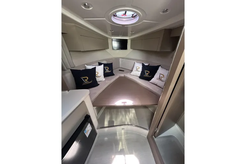  Yacht Photos Pics Luxurious interior of 2025 L'ACQUA LR350 yacht with elegant seating and cushions.