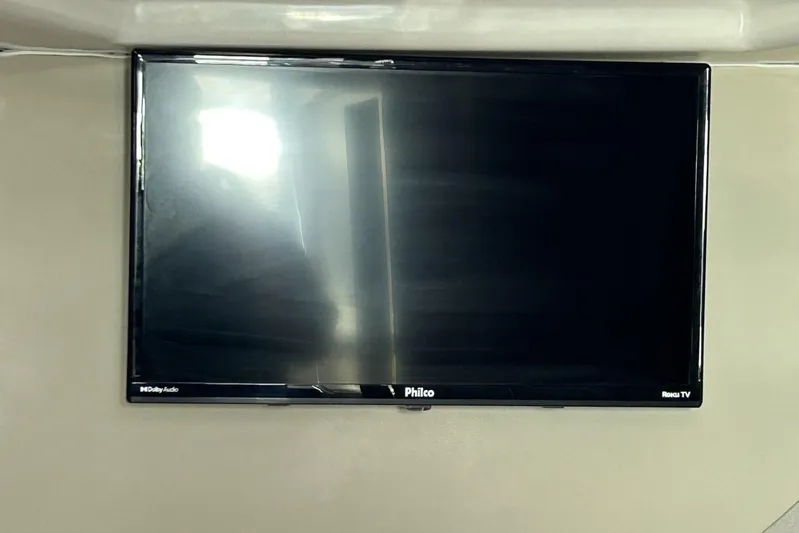  Yacht Photos Pics Wall-mounted Philco Roku TV with Dolby Audio, reflecting light. L'ACQUA LR350, 2025 model.