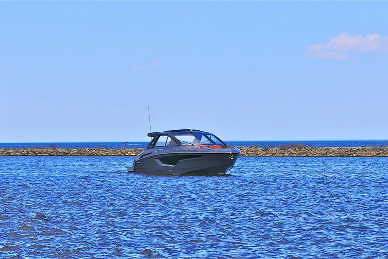  Yacht Photos Pics 2026 Cruisers Yachts 42 GLS I/O on open water under clear blue sky.