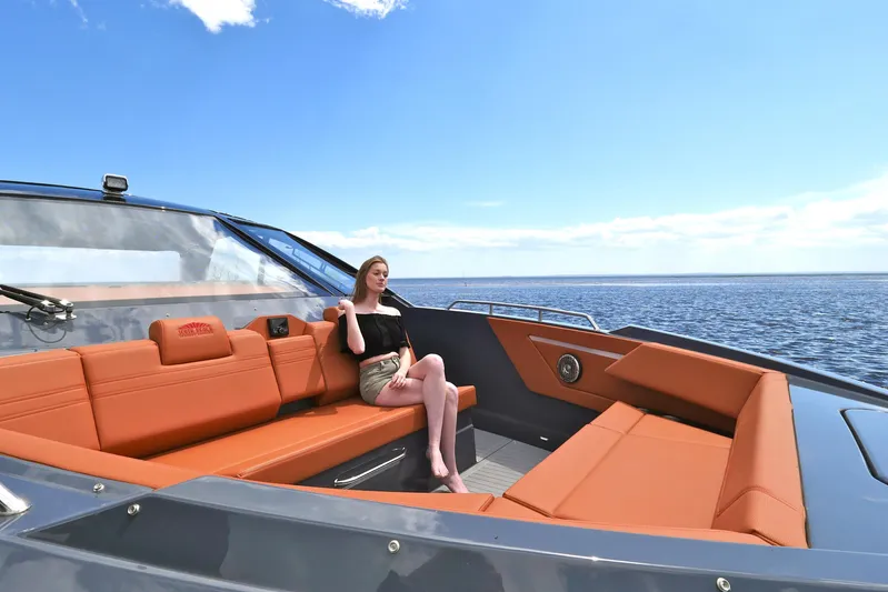  Yacht Photos Pics 2026 Cruisers Yachts 42 GLS I/O with woman relaxing on deck, ocean view.