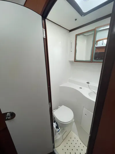  Yacht Photos Pics Compact bathroom in 2005 Lagoon 570 Switch yacht with modern fixtures.