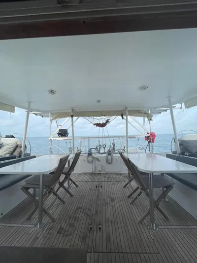  Yacht Photos Pics Lagoon 570 Switch 2005 yacht deck with seating, ocean view, and hammock.