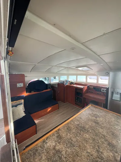  Yacht Photos Pics Interior of 2005 Lagoon 570 Switch catamaran with seating and navigation area.