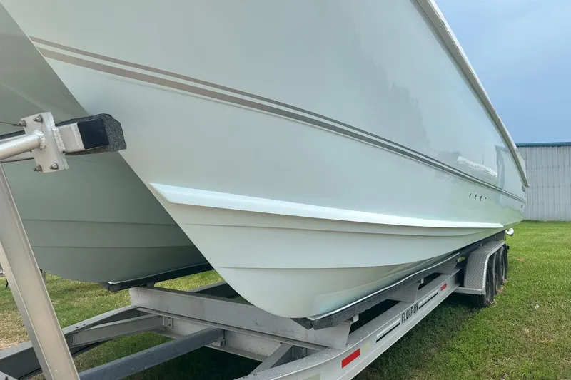 Cat Gone Willd Yacht Photos Pics 2023 Twin Vee 340 GFX CC boat on trailer, side view.