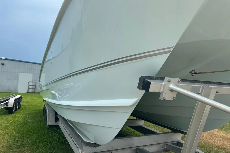 Cat Gone Willd Yacht Photos Pics 2023 Twin Vee 340 GFX CC boat on trailer, side view, outdoors.