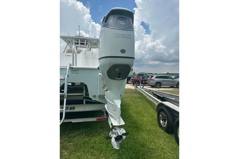 Cat Gone Willd Yacht Photos Pics 2023 Twin Vee 340 GFX CC boat with Suzuki 350 outboard motor on trailer.