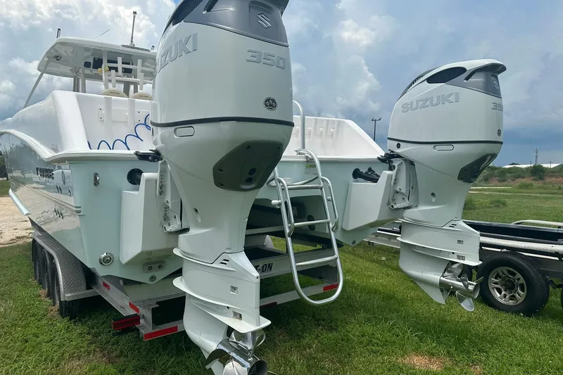 Cat Gone Willd Yacht Photos Pics 2023 Twin Vee 340 GFX CC boat with dual Suzuki 350 outboard engines on a trailer.