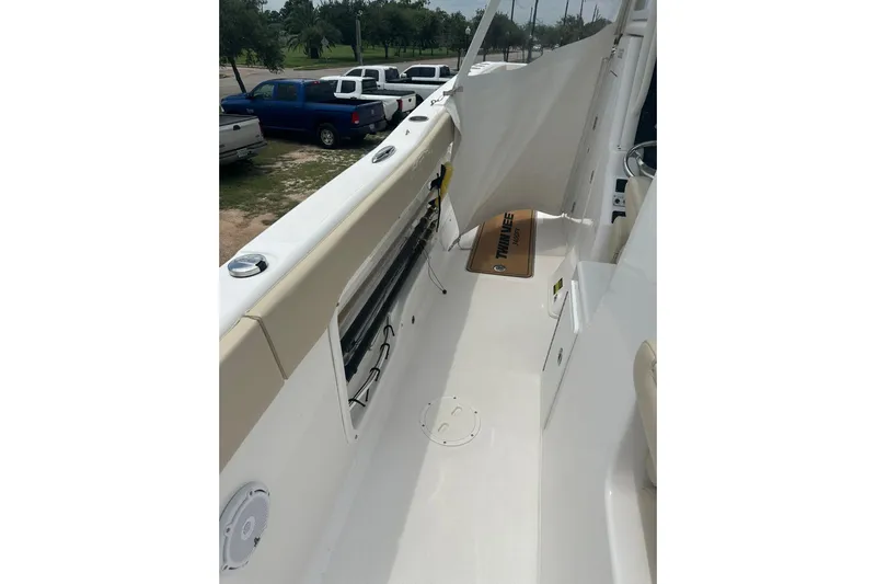 Cat Gone Willd Yacht Photos Pics 2023 Twin Vee 340 GFX CC boat interior with seating and storage compartments.