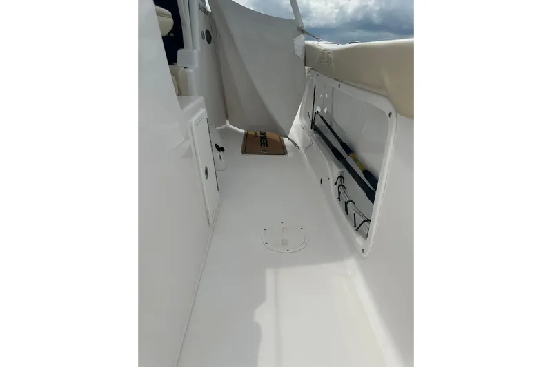 Cat Gone Willd Yacht Photos Pics 2023 Twin Vee 340 GFX CC boat interior with storage compartments and seating.