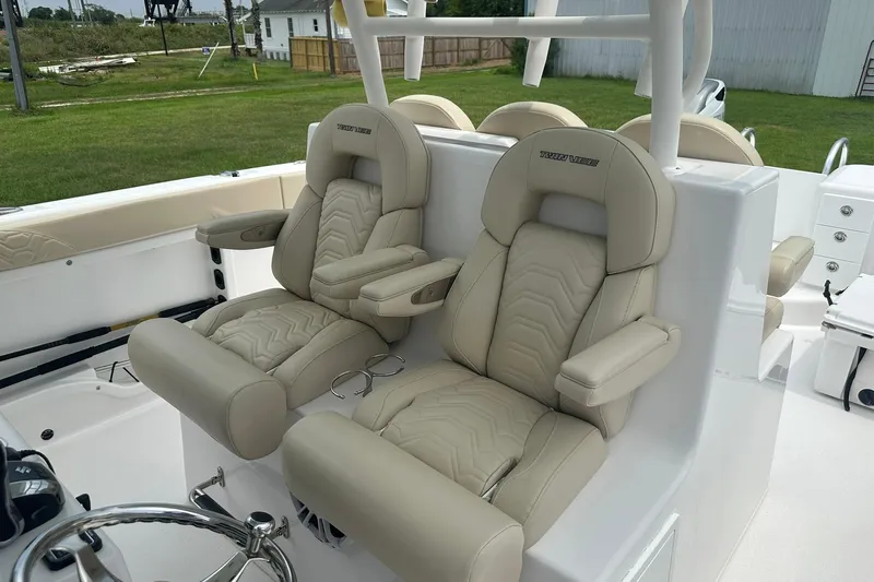 Cat Gone Willd Yacht Photos Pics 2023 Twin Vee 340 GFX CC boat with luxurious beige seating and modern design.