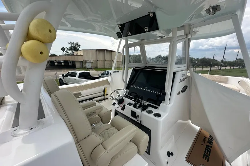 Cat Gone Willd Yacht Photos Pics 2023 Twin Vee 340 GFX CC boat interior with modern helm and seating.