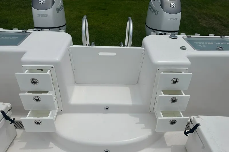 Cat Gone Willd Yacht Photos Pics 2023 Twin Vee 340 GFX CC boat with Suzuki 350 engines and storage compartments.