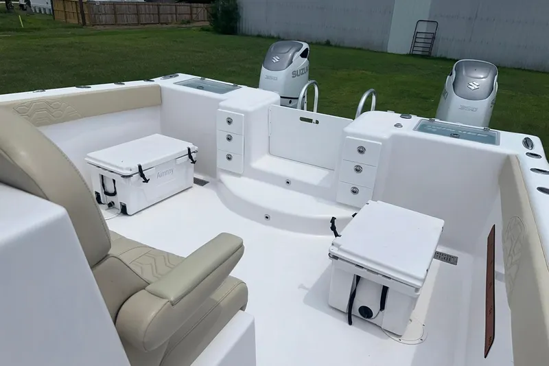 Cat Gone Willd Yacht Photos Pics 2023 Twin Vee 340 GFX CC boat interior with seating, storage, and dual Suzuki engines.