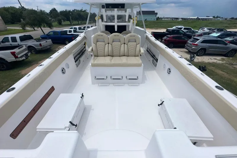 Cat Gone Willd Yacht Photos Pics 2023 Twin Vee 340 GFX CC boat interior with beige seating and spacious deck.