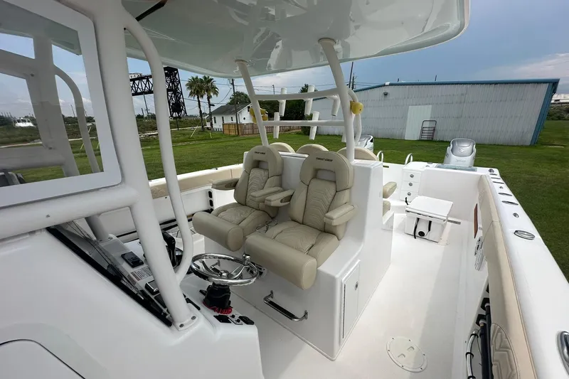 Cat Gone Willd Yacht Photos Pics 2023 Twin Vee 340 GFX CC boat interior with luxurious seating and modern controls.