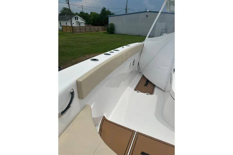 Cat Gone Willd Yacht Photos Pics 2023 Twin Vee 340 GFX CC boat interior with cushioned seating and rod holders.