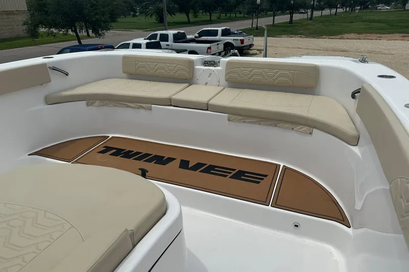 Cat Gone Willd Yacht Photos Pics 2023 Twin Vee 340 GFX CC boat interior with beige seating and logo mat.