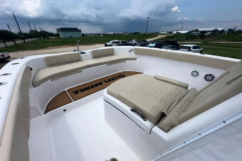Cat Gone Willd Yacht Photos Pics 2023 Twin Vee 340 GFX CC boat interior with beige seating and spacious deck.