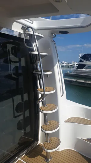 Trades Welcome Yacht Photos Pics Spiral staircase on a 1999 Carver 530 Voyager Pilothouse yacht.