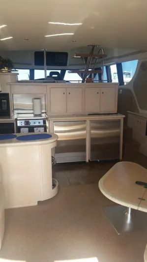 Trades Welcome Yacht Photos Pics Interior of 1999 Carver 530 Voyager Pilothouse yacht with modern kitchen.