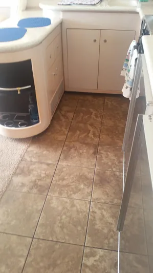 Trades Welcome Yacht Photos Pics 1999 Carver 530 Voyager Pilothouse kitchen with tiled floor and cabinetry.