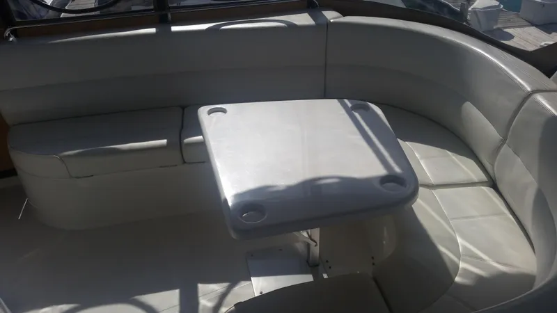 Trades Welcome Yacht Photos Pics 1999 Carver 530 Voyager Pilothouse interior seating area with table.