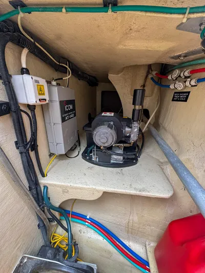 Adventure Yacht Photos Pics Engine compartment of a 2013 Antares 44i boat, featuring electrical components and wiring.