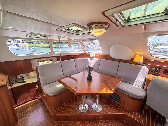 Adventure Yacht Photos Pics Luxurious interior of 2013 Antares 44i yacht with elegant seating and wooden finishes.