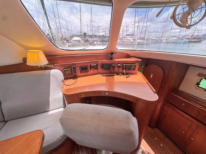 Adventure Yacht Photos Pics Interior of 2013 Antares 44i yacht with navigation station and comfortable seating.