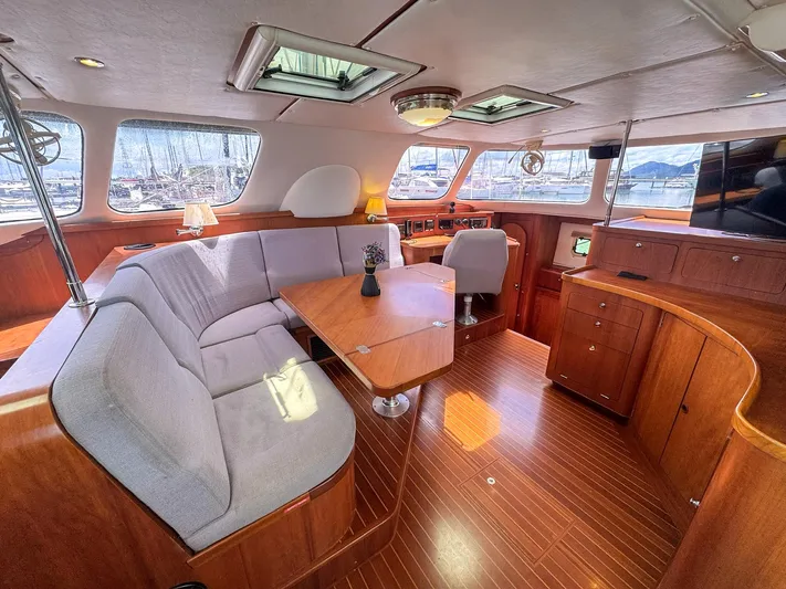 Adventure Yacht Photos Pics Luxurious interior of 2013 Antares 44i yacht with elegant wood finish and spacious seating.