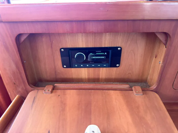 Adventure Yacht Photos Pics Wooden interior of 2013 Antares 44i with built-in stereo system.