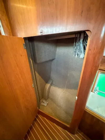 Adventure Yacht Photos Pics Wooden closet interior on a 2013 Antares 44i yacht with hangers.