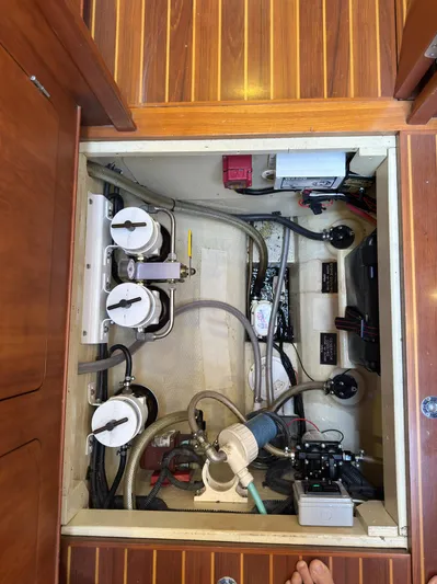 Adventure Yacht Photos Pics Engine compartment of a 2013 Antares 44i yacht, showcasing mechanical components and wiring.