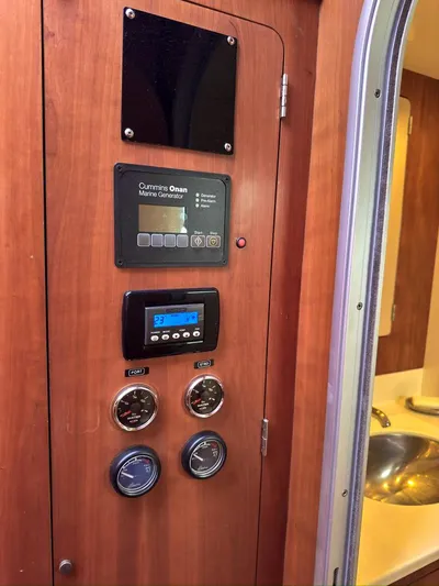 Adventure Yacht Photos Pics Control panel inside 2013 Antares 44i yacht, featuring gauges and electronic displays.