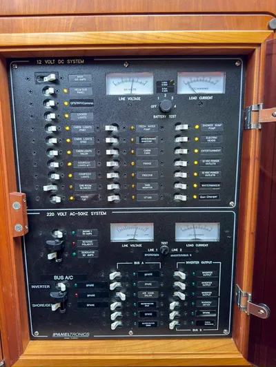 Adventure Yacht Photos Pics Electrical control panel on a 2013 Antares 44i, featuring 12V DC and 220V AC systems.