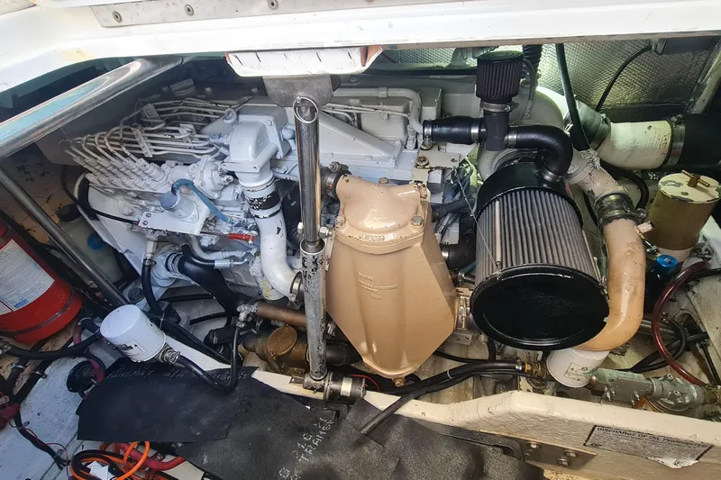  Yacht Photos Pics Engine compartment of a 1998 Formula 41 Performance Cruiser boat, showcasing mechanical components.
