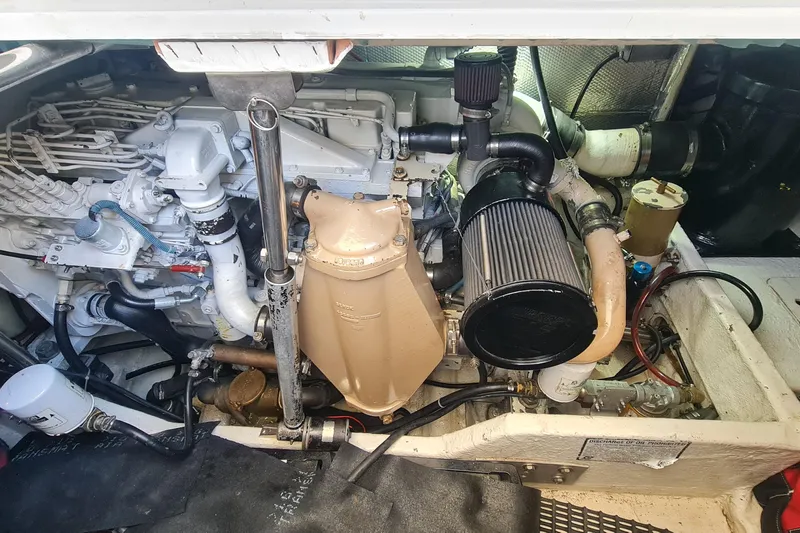  Yacht Photos Pics Engine compartment of a 1998 Formula 41 Performance Cruiser, showcasing mechanical components.
