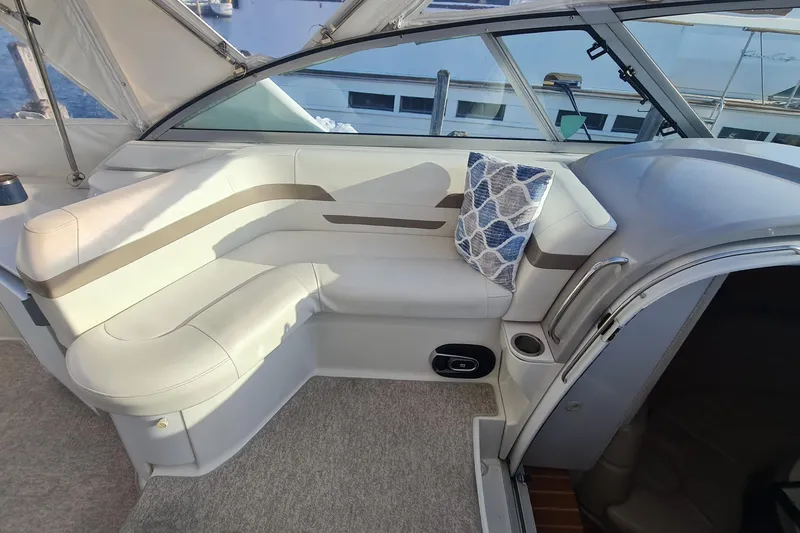  Yacht Photos Pics Interior of a 1998 Formula 41 Performance Cruiser with white seating and decorative pillow.