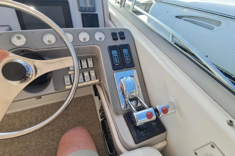  Yacht Photos Pics 1998 Formula 41 Performance Cruiser helm with steering wheel and control panel.